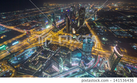 Dubai downtown day to night transition with city lights from above timelapse Dubai downtown day to night transition with city lights from above timelapse 141536436