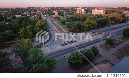Road construction site with tram tracks repair and maintenance aerial timelapse. Road construction site with tram tracks repair and maintenance aerial timelapse. 141536591