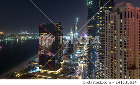 Waterfront overview Jumeirah Beach Residence JBR skyline aerial day to night timelapse with yacht and boats Waterfront overview Jumeirah Beach Residence JBR skyline aerial day to night timelapse with yacht and boats 141536614