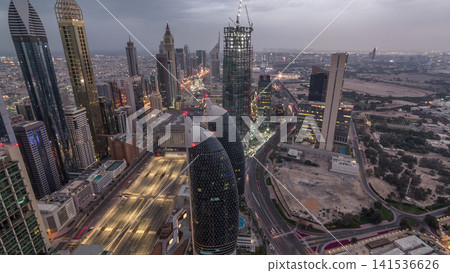Skyline of the buildings of Sheikh Zayed Road and DIFC aerial night timelapse in Dubai, UAE. Skyline of the buildings of Sheikh Zayed Road and DIFC aerial night timelapse in Dubai, UAE. 141536626