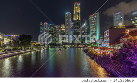 Singapore quay with tall skyscrapers in the central business district on Boat Quay day to night timelapse Singapore quay with tall skyscrapers in the central business district on Boat Quay day to night timelapse 141536669