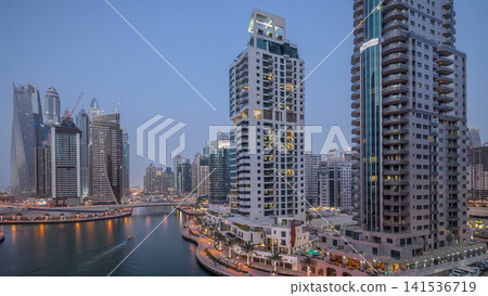 Beautiful aerial top view day to night transition timelapse of Dubai Marina canal Beautiful aerial top view day to night transition timelapse of Dubai Marina canal 141536719