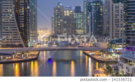 Beautiful aerial top view day to night transition timelapse of Dubai Marina canal Beautiful aerial top view day to night transition timelapse of Dubai Marina canal 141536721