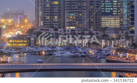 Beautiful aerial top view day to night transition timelapse of Dubai Marina canal Beautiful aerial top view day to night transition timelapse of Dubai Marina canal 141536722