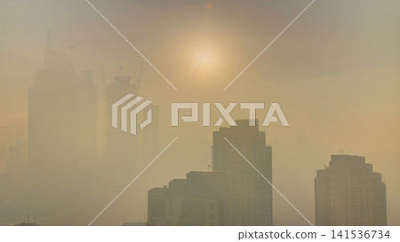 Foggy morning sunrise in downtown of Dubai timelapse. Foggy morning sunrise in downtown of Dubai timelapse. 141536734