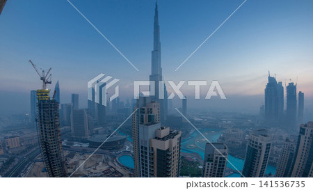 Foggy morning in downtown of Dubai night to day timelapse. Foggy morning in downtown of Dubai night to day timelapse. 141536735