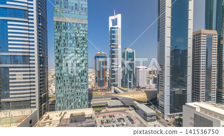Skyline view of the buildings of Sheikh Zayed Road and DIFC all day timelapse in Dubai, UAE. Skyline view of the buildings of Sheikh Zayed Road and DIFC all day timelapse in Dubai, UAE. 141536750
