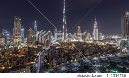 Dubai Downtown skyline night timelapse with Burj Khalifa and other towers panoramic view from the top in Dubai Dubai Downtown skyline night timelapse with Burj Khalifa and other towers panoramic view from the top in Dubai 141536786