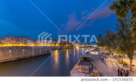 View to the Pont De La Tournelle on the River Seine day to night timelapse with waterfront. View to the Pont De La Tournelle on the River Seine day to night timelapse with waterfront. 141536855
