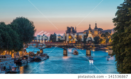 View to Pont des Arts in Paris after sunset day to night timelapse, France View to Pont des Arts in Paris after sunset day to night timelapse, France 141536867