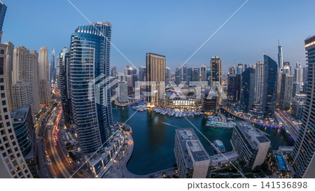 Evening illumination of Dubai Marina day to night aerial timelapse, UAE. Evening illumination of Dubai Marina day to night aerial timelapse, UAE. 141536898