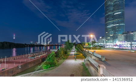 Beautiful cityscape with modern buildings day to night timelapse, the tallest skyscraper in Austria 141536952