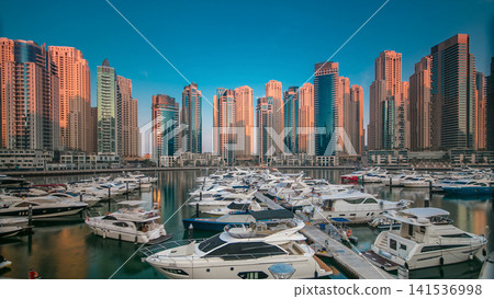 Dubai Marina at early morning hour timelapse with yachts Dubai Marina at early morning hour timelapse with yachts 141536998