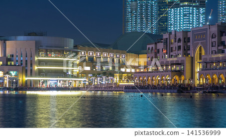 The Dancing Fountain of Dubai and lake day to night timelapse at dusk in Dubai, UAE. The Dancing Fountain of Dubai and lake day to night timelapse at dusk in Dubai, UAE. 141536999