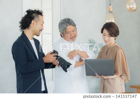 A team taking menu photos at a restaurant. A team taking menu photos at a restaurant. 141537147