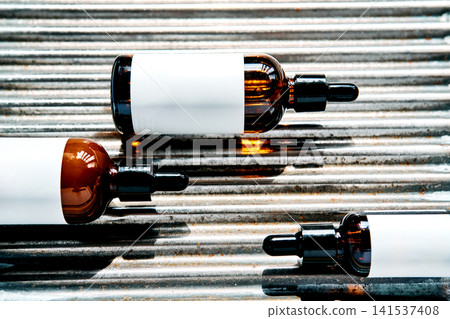 Concentrated waterless beauty skincare droppers on metal surface Concentrated waterless beauty skincare droppers on metal surface 141537408