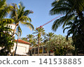Palm Trees Surround Mediterranean Style Building And Crane 141538885