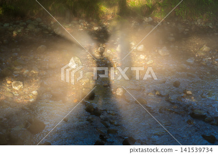 A Brocken spectre floating in the river mist from Fujinomiya City. A Brocken spectre floating in the river mist from Fujinomiya City. 141539734