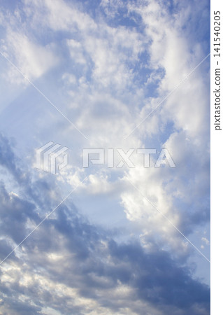 It is a cloudy late afternoon sky. 141540205