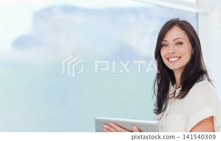 Adult woman standing holding tablet light blouse smiling-camera office window-sea-cliff, copy space Adult woman standing holding tablet light blouse smiling-camera office window-sea-cliff, copy space 141540309
