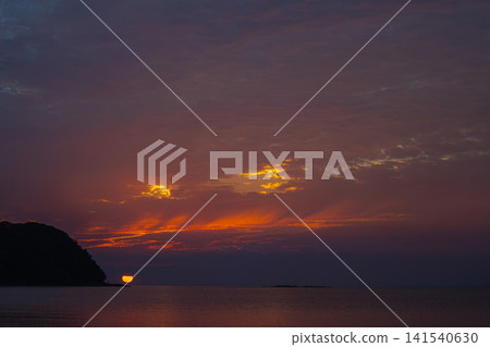 The red-burning sun, the majestic sky painted in the colors of twilight. The red-burning sun, the majestic sky painted in the colors of twilight. 141540630