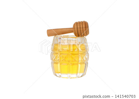 Golden honey in a glass container with a dipper, isolated on white, PNG Golden honey in a glass container with a dipper, isolated on white, PNG 141540703