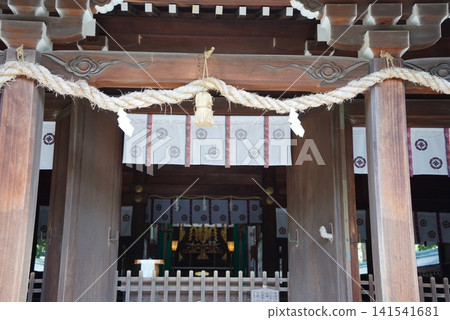 This is a scene from the grounds of Shoin Shrine, dedicated to Yoshida Shoin. A dignified wooden torii gate. This is a scene from the grounds of Shoin Shrine, dedicated to Yoshida Shoin. A dignified wooden torii gate. 141541681