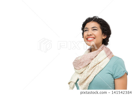 Woman in teal top scarf posing right looking up smiling against seamless white backdrop, copy space Woman in teal top scarf posing right looking up smiling against seamless white backdrop, copy space 141542384