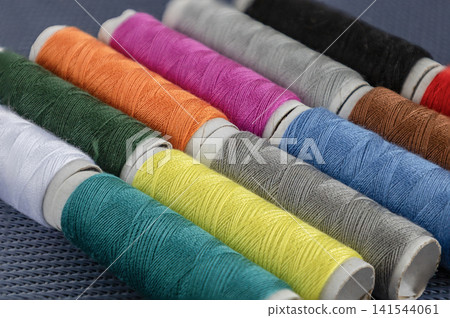 Colorful Sewing Threads and Measuring Tape Colorful Sewing Threads and Measuring Tape 141544061