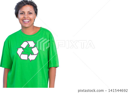 Woman standing left of backdrop smiling at camera wearing green tee with recycling logo, copy space Woman standing left of backdrop smiling at camera wearing green tee with recycling logo, copy space 141544692
