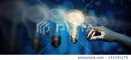Hand pointing at glowing lightbulb with digital ideas 141545279