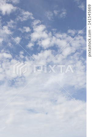 It is a blue sky with cirrocumulus clouds. It is a blue sky with cirrocumulus clouds. 141545669