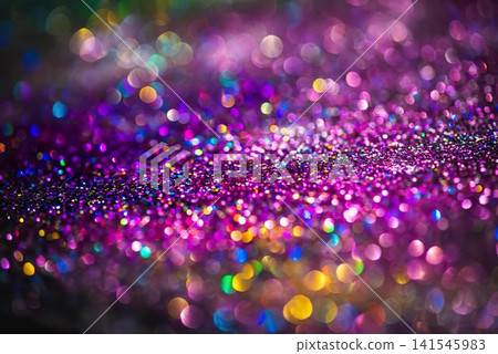 Close-up of colorful glitter particles sparkling on dark background Close-up of colorful glitter particles sparkling on dark background 141545983