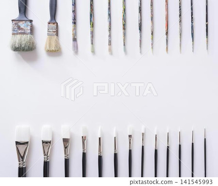 Close-up of paintbrushes with black and white handles Close-up of paintbrushes with black and white handles 141545993