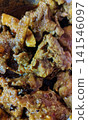 Delicious rustic homemade meat curry with spices served in bowl. Delicious rustic homemade meat curry with spices served in bowl. 141546097