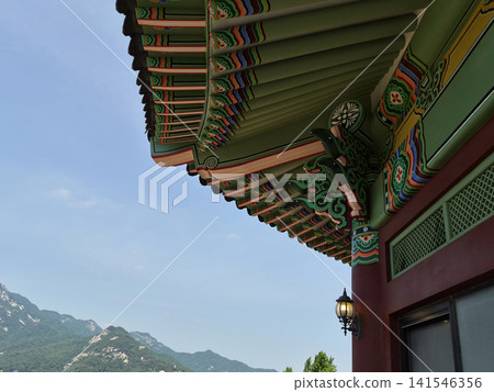 It is a landscape featuring a roof with *dancheong* (traditional decorative coloring). It is a landscape featuring a roof with *dancheong* (traditional decorative coloring). 141546356