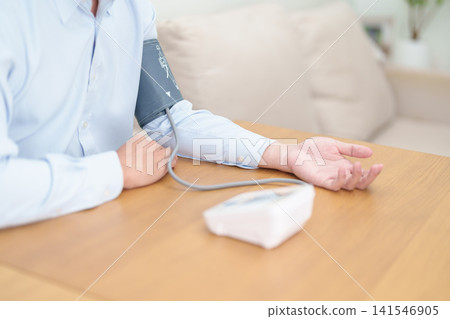 Man checking Blood pressure by Blood pressure monitor with Cuff. Systolic, SYS, Diastolic, DIA, Pulse, Hypertension, Hypotension, Heart rate, Cardiovascular Disease and May World hypertension day Man checking Blood pressure by Blood pressure monitor with Cuff. Systolic, SYS, Diastolic, DIA, Pulse, Hypertension, Hypotension, Heart rate, Cardiovascular Disease and May World hypertension day 141546905