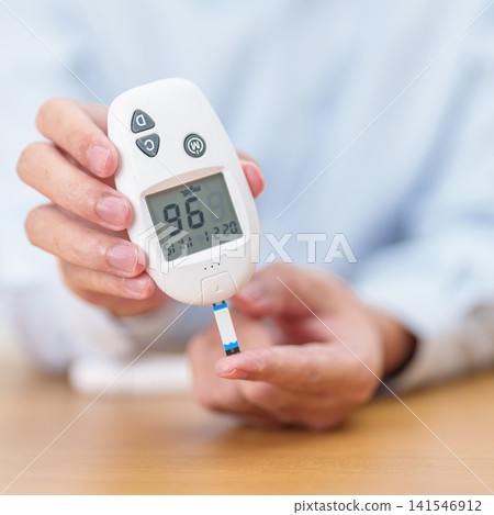 Hand checking Diabetes or Blood glucose self testing by digital blood glucose meter with lancet pen. high blood sugar level, World Diabetes Day, Glycemia, Hypoglycemia, Hyperglycemia and insulin Hand checking Diabetes or Blood glucose self testing by digital blood glucose meter with lancet pen. high blood sugar level, World Diabetes Day, Glycemia, Hypoglycemia, Hyperglycemia and insulin 141546912