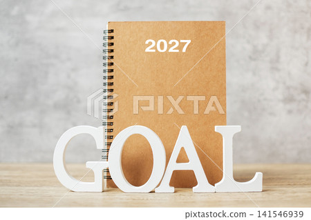 2027 Happy New Year with notebook and wooden number. goal, countdown, Resolution, Plan, Action and Mission Concept 2027 Happy New Year with notebook and wooden number. goal, countdown, Resolution, Plan, Action and Mission Concept 141546939