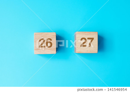 wooden cube block with 2027 text on blue background. Resolution, plan, review, goal, start and New Year holiday concepts 141546954