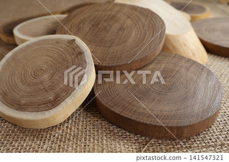 Tree rings of various cross-sections of wood Tree rings of various cross-sections of wood 141547321