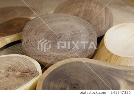 Tree rings of various cross-sections of wood Tree rings of various cross-sections of wood 141547325