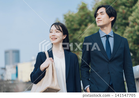 Men and women in suit Men and women in suit 141547705