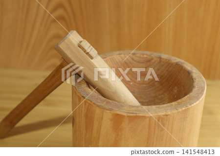 Miniature sculptures of a mortar and pestle Miniature sculptures of a mortar and pestle 141548413