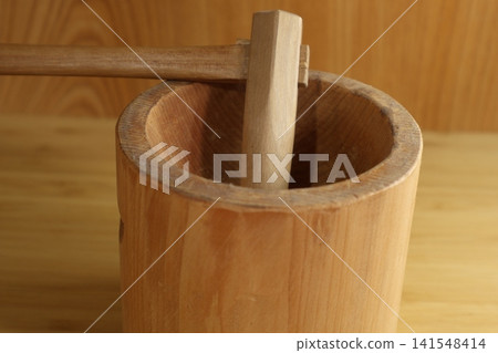 Miniature sculptures of a mortar and pestle Miniature sculptures of a mortar and pestle 141548414