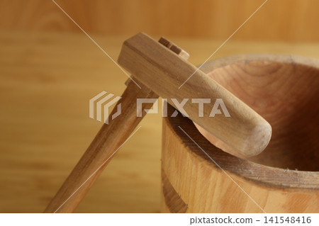 Miniature sculptures of a mortar and pestle Miniature sculptures of a mortar and pestle 141548416