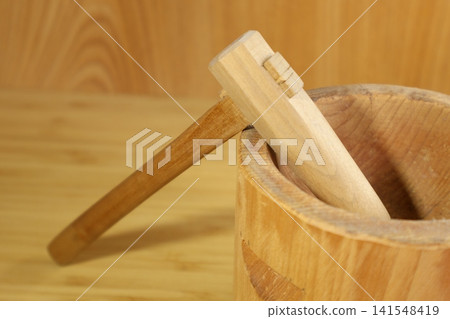 Miniature sculptures of a mortar and pestle Miniature sculptures of a mortar and pestle 141548419