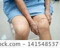 Asian elderly woman patient with scar knee replacement surgery in hospital. 141548537