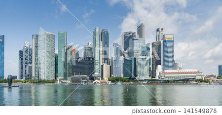 Panoramic view of modern skyscrapers along Marina Bay in the Raffles Place financial district from the Marina Bay Sands observation deck, Singapore. Panoramic view of modern skyscrapers along Marina Bay in the Raffles Place financial district from the Marina Bay Sands observation deck, Singapore. 141549878