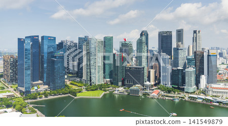 Panoramic view of modern skyscrapers along Marina Bay in the Raffles Place financial district from the Marina Bay Sands Skypark, Singapore. Panoramic view of modern skyscrapers along Marina Bay in the Raffles Place financial district from the Marina Bay Sands Skypark, Singapore. 141549879